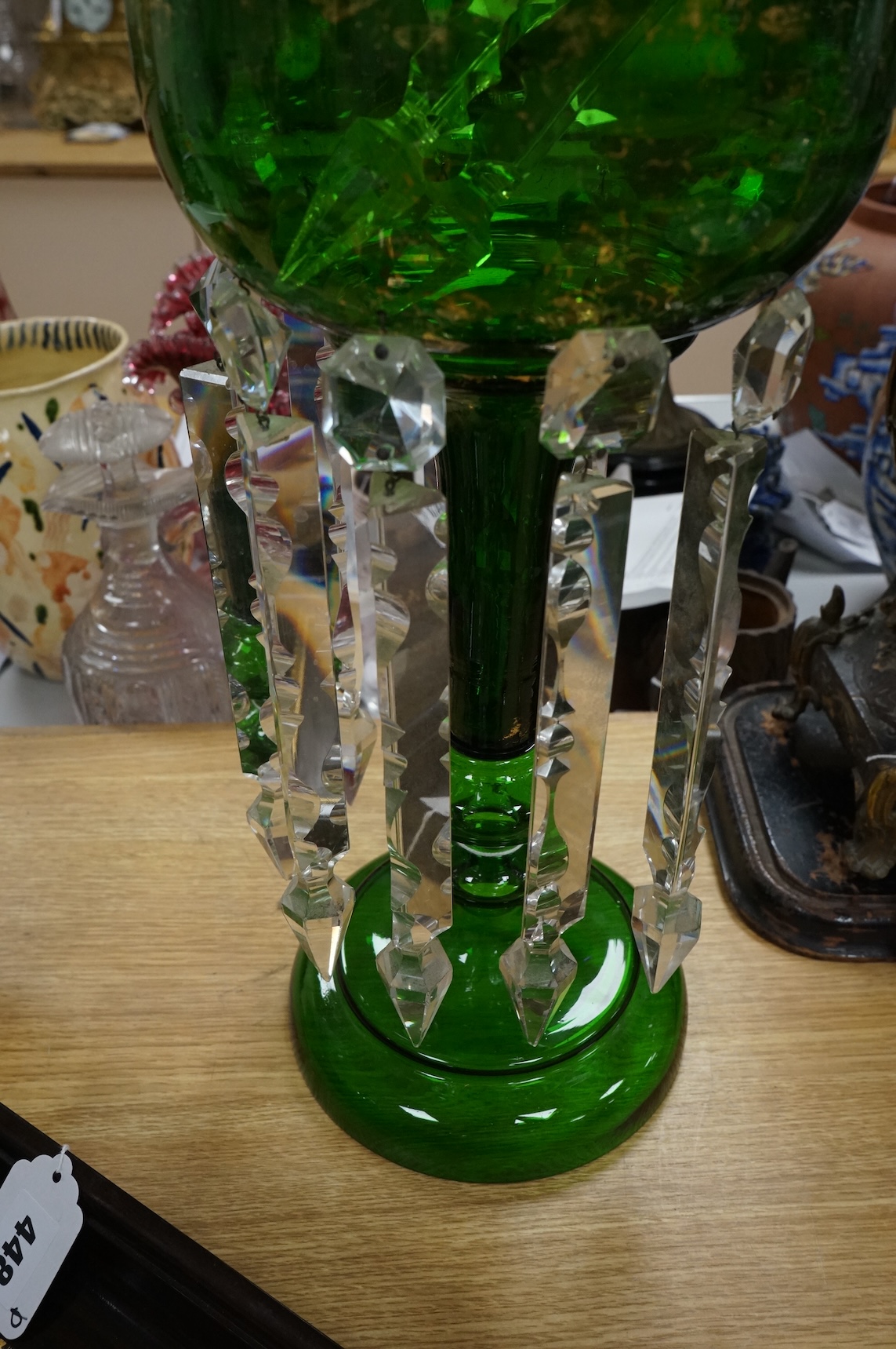 A large Victorian green glass lustre with drops, 45cm high